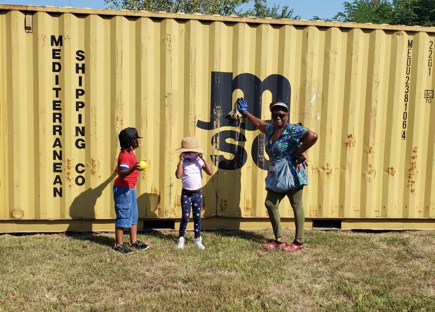 Dee Campbell Carter with the new shipping container storage shed at Friendship Garden