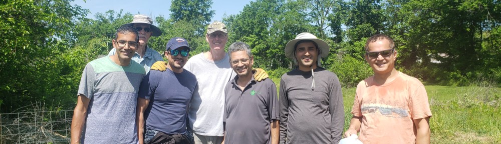 Some of the people who cleaned up the Ash St. garden, including some of the new garden leaders stand together in the cleared garden area